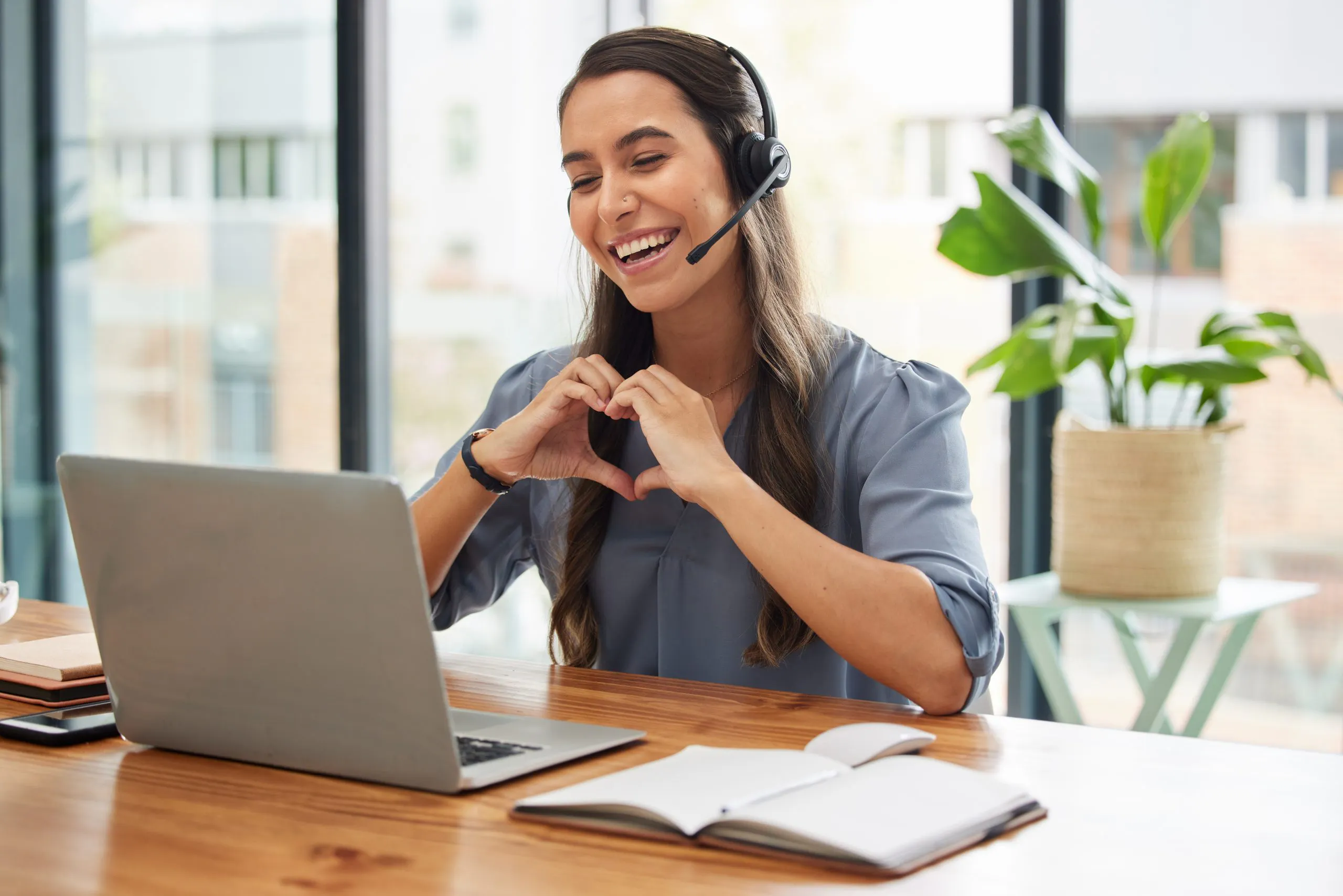 Video,Call,,Heart,And,Business,Woman,In,Virtual,Meeting,,Call Happy user experience. Woman makes heart shape with hands. VOSS Insights contributes to a seamless and high-quality user experience across your UC environment.