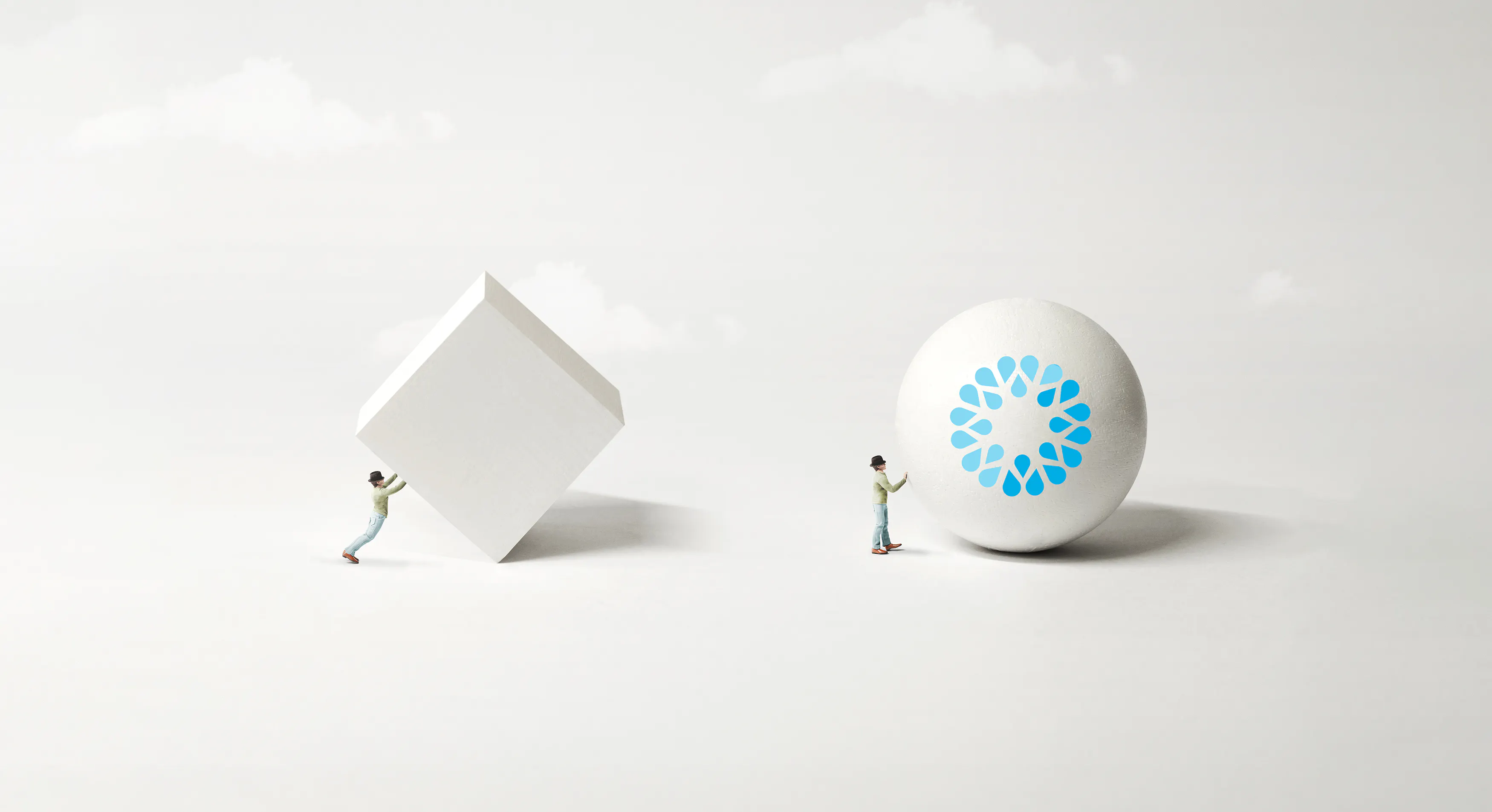 Advance faster with VOSS AI powered automation - image shows person easily rolling a VOSS ball along, while another person behind tries to push a cube with difficulty