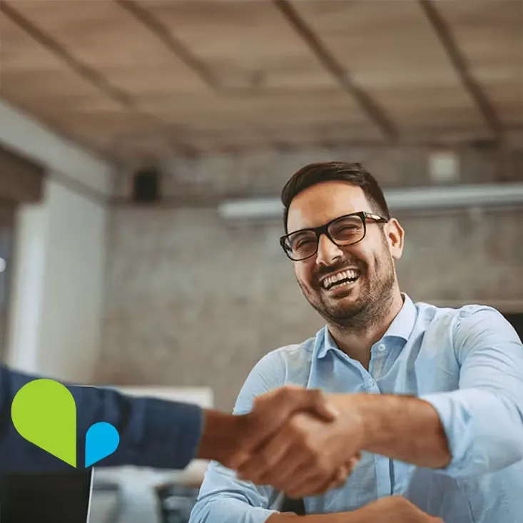 Working with VOSS is different - photo of a very happy man shaking hands